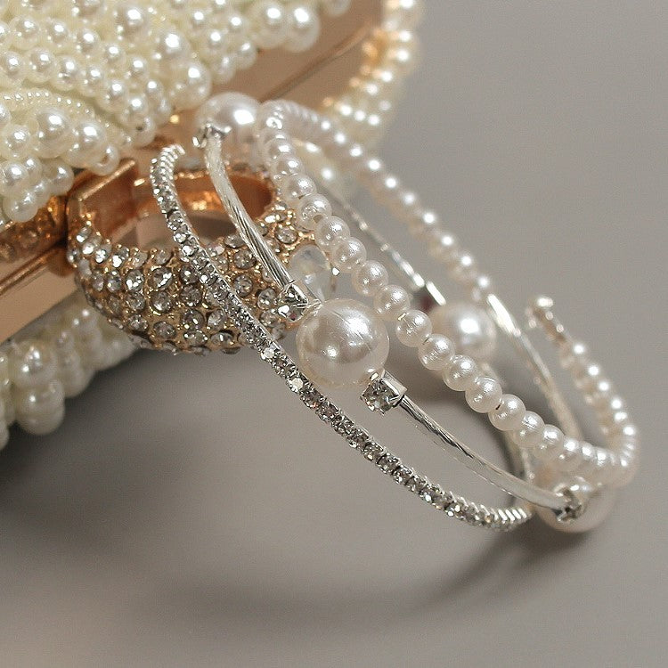 Triple-layered pearl and crystal cuff bracelet in gold and silver — stacked bangle design with rhinestones and faux pearls