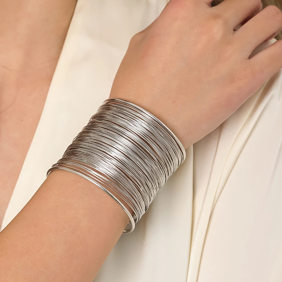 Chunky wire-style open cuff bracelet in gold and silver – layered metallic statement bangle for bold modern looks