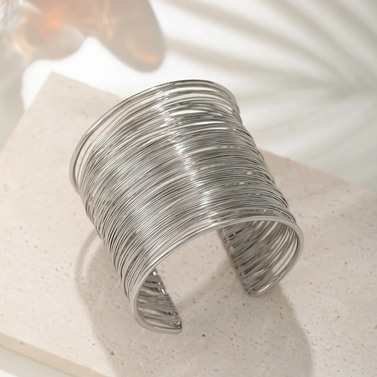 Chunky wire-style open cuff bracelet in gold and silver – layered metallic statement bangle for bold modern looks