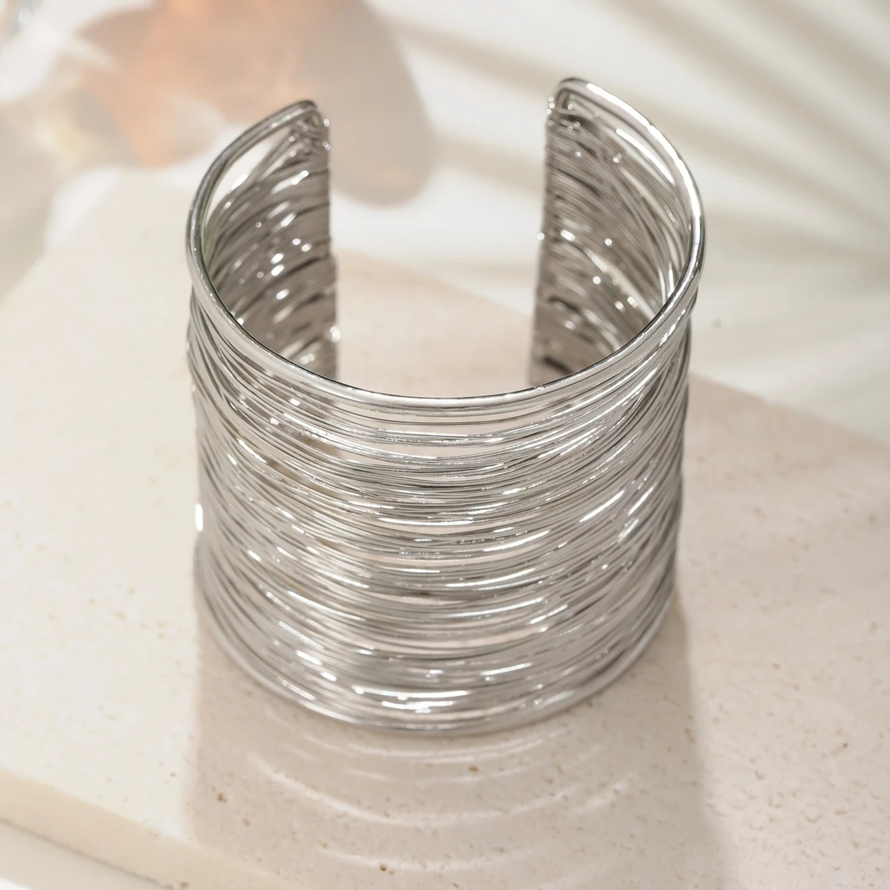 Chunky wire-style open cuff bracelet in gold and silver – layered metallic statement bangle for bold modern looks