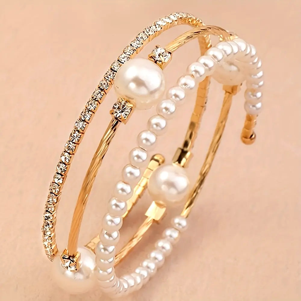 Triple-layered pearl and crystal cuff bracelet in gold and silver — stacked bangle design with rhinestones and faux pearls