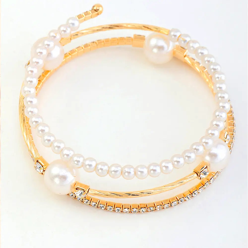 Triple-layered pearl and crystal cuff bracelet in gold and silver — stacked bangle design with rhinestones and faux pearls