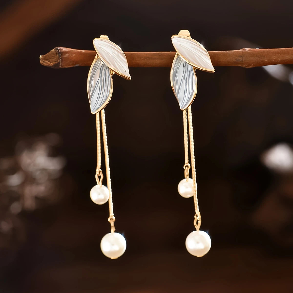 White and gold leaf earrings with dangling chains and faux pearls – long botanical statement jewelry for women