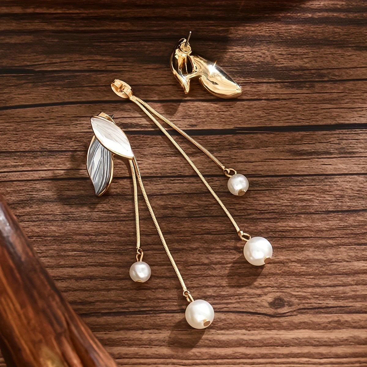 White and gold leaf earrings with dangling chains and faux pearls – long botanical statement jewelry for women