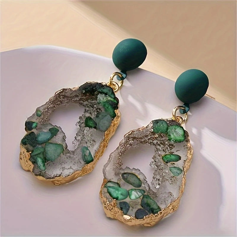 Emerald green geode-inspired drop earrings with gold-plated edges and matte forest green studs – bold resin statement jewelry for women