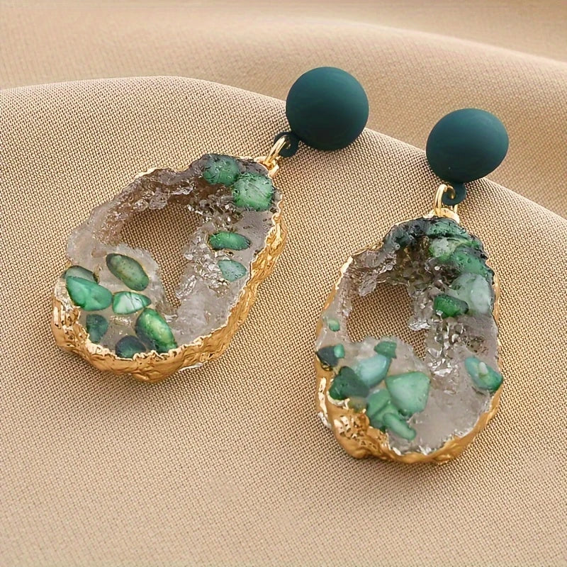 Emerald green geode-inspired drop earrings with gold-plated edges and matte forest green studs – bold resin statement jewelry for women