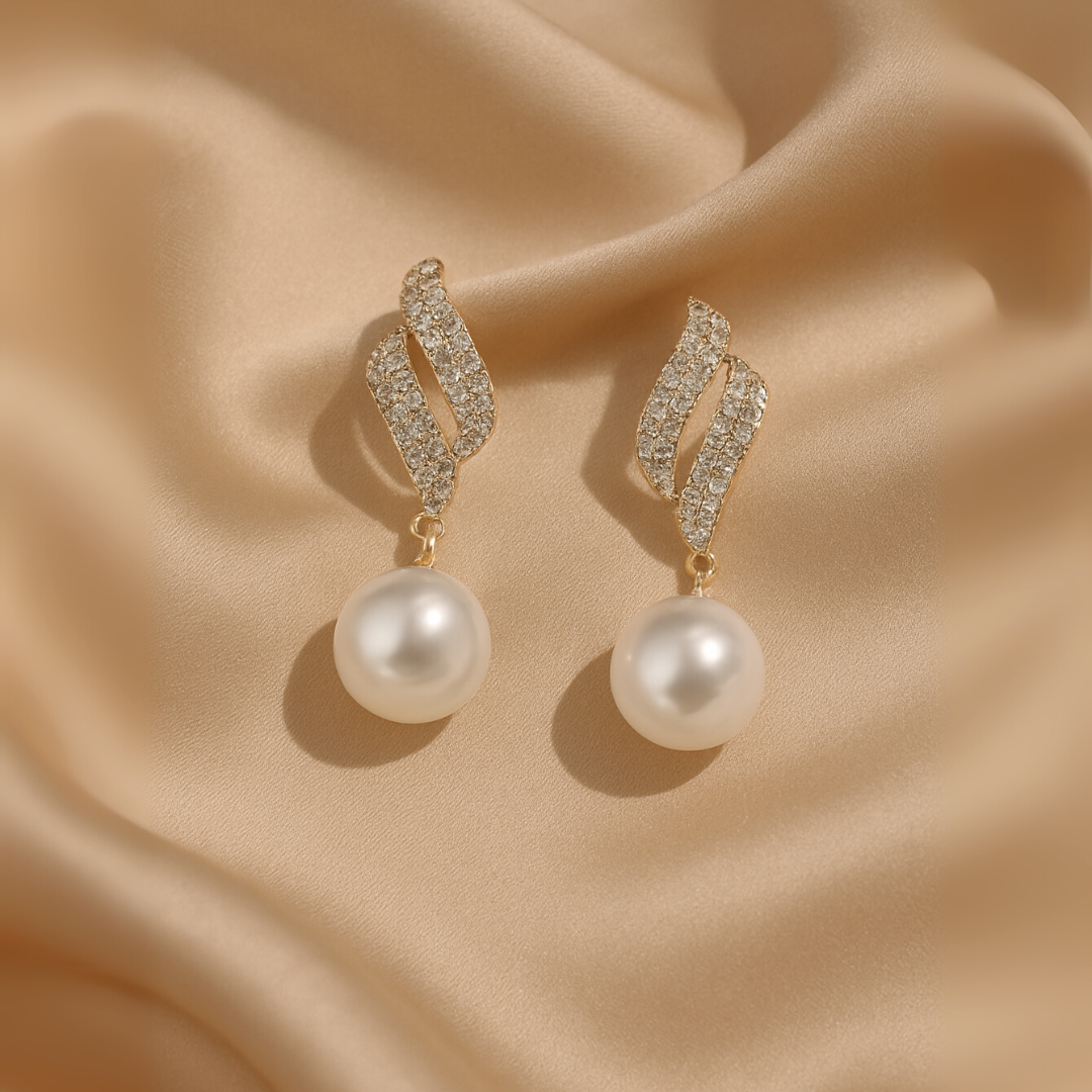 Gold-tone crystal wave earrings with dangling faux pearls – elegant party jewelry for women