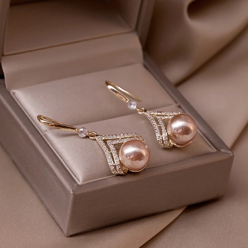 Champagne pearl drop earrings with gold V-shaped crystal detailing – elegant formal jewelry for women