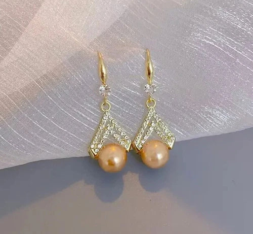 Champagne pearl drop earrings with gold V-shaped crystal detailing – elegant formal jewelry for women