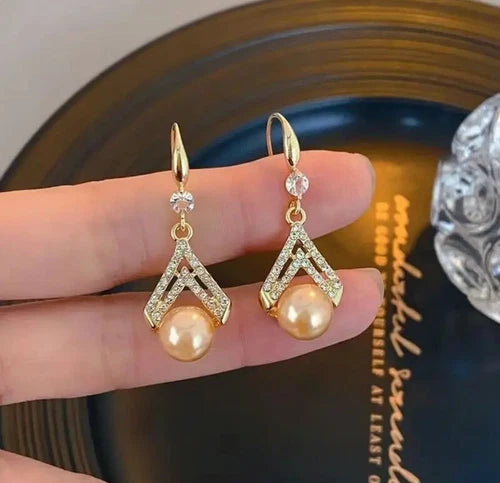 Champagne pearl drop earrings with gold V-shaped crystal detailing – elegant formal jewelry for women