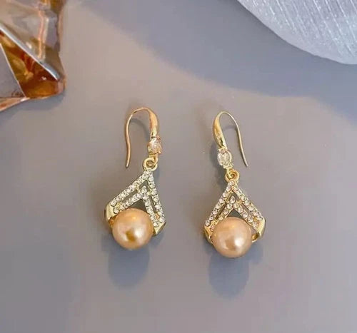 Champagne pearl drop earrings with gold V-shaped crystal detailing – elegant formal jewelry for women