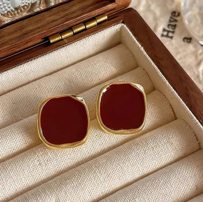 Bold crimson red enamel stud earrings with abstract gold trim – modern geometric jewelry for women