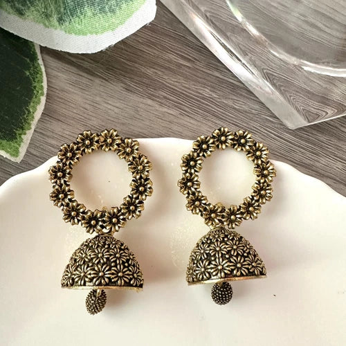 Antique gold floral jhumka earrings with circular flower top and bell-shaped drop – traditional desi jewelry for women