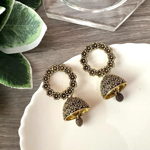 Antique gold floral jhumka earrings with circular flower top and bell-shaped drop – traditional desi jewelry for women