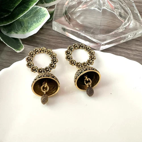 Antique gold floral jhumka earrings with circular flower top and bell-shaped drop – traditional desi jewelry for women