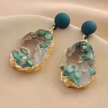Emerald green geode-inspired drop earrings with gold-plated edges and matte forest green studs – bold resin statement jewelry for women