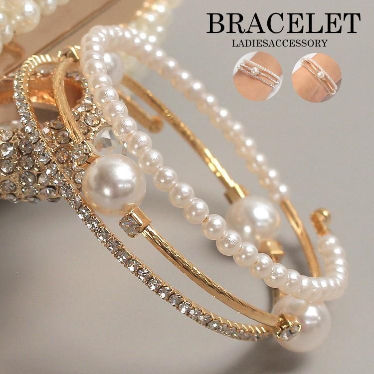 Triple-layered pearl and crystal cuff bracelet in gold and silver — stacked bangle design with rhinestones and faux pearls