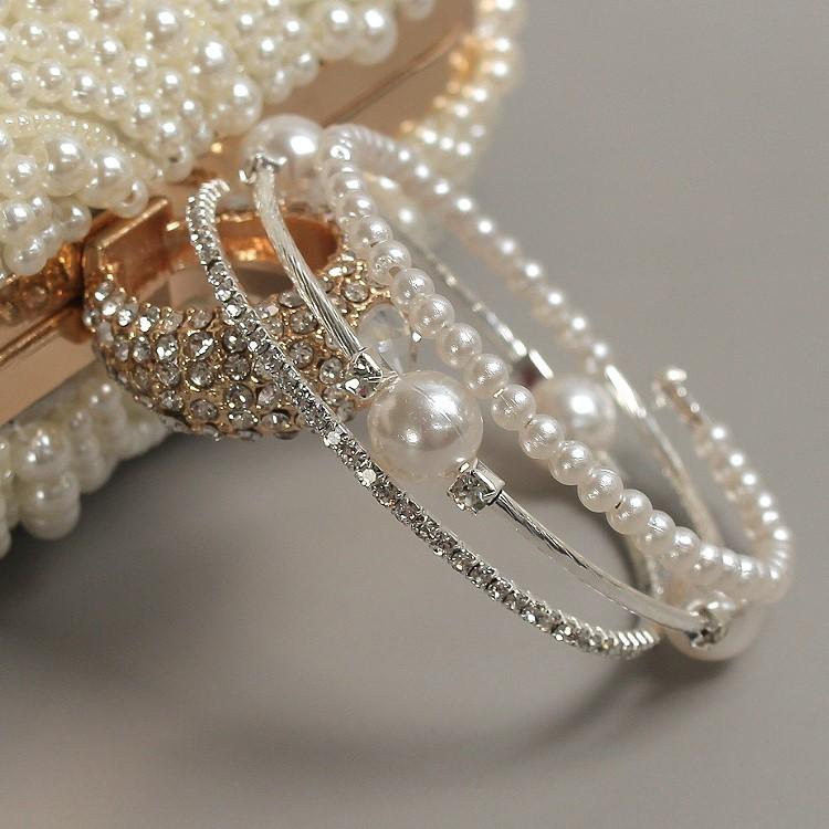 Triple-layered pearl and crystal cuff bracelet in gold and silver — stacked bangle design with rhinestones and faux pearls