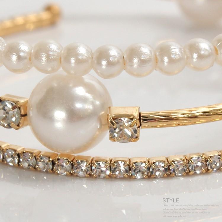 Triple-layered pearl and crystal cuff bracelet in gold and silver — stacked bangle design with rhinestones and faux pearls
