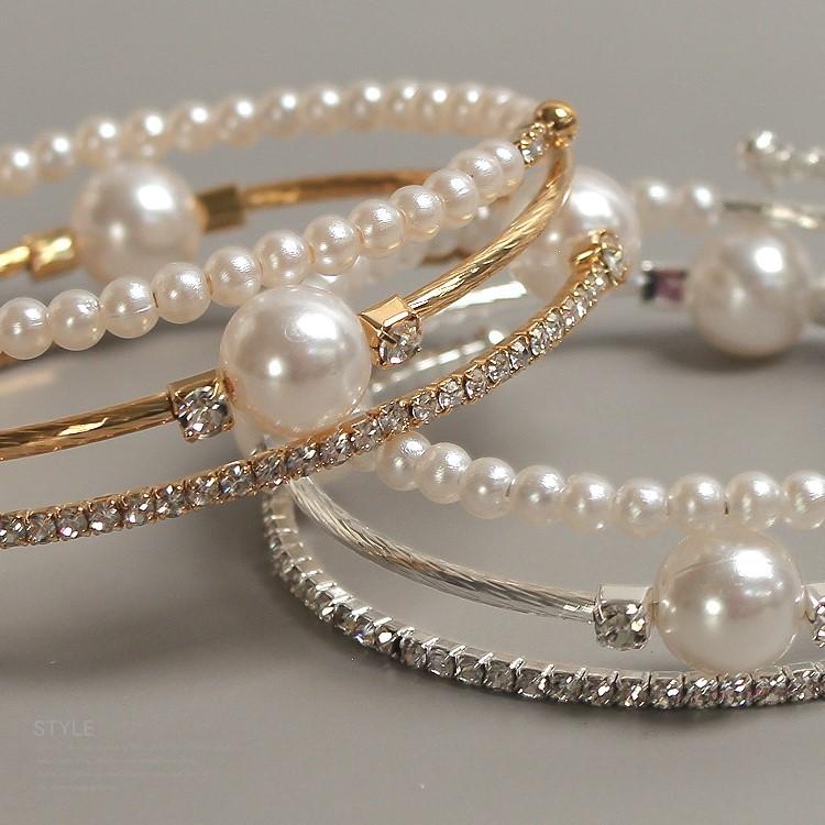 Triple-layered pearl and crystal cuff bracelet in gold and silver — stacked bangle design with rhinestones and faux pearls